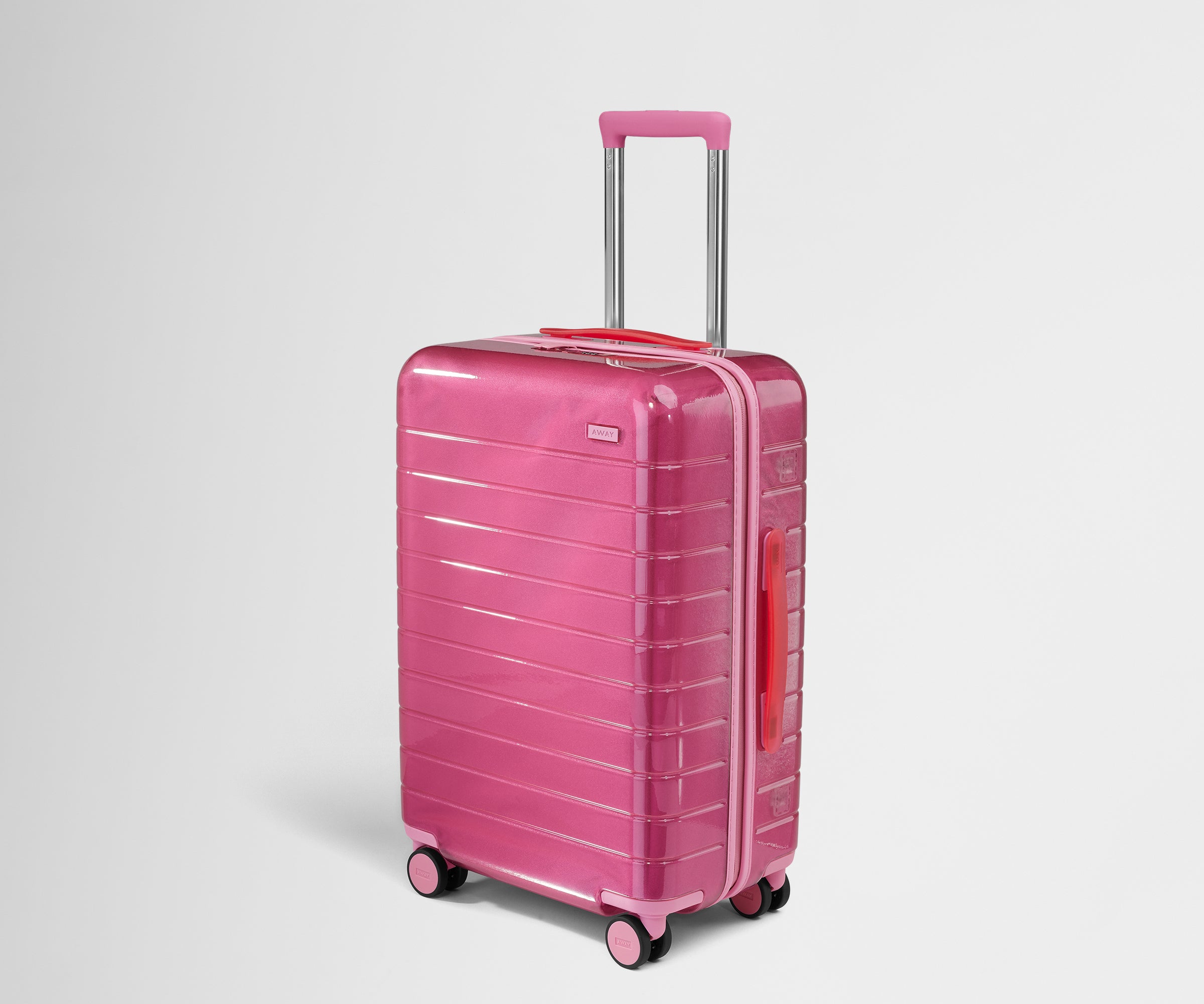 The Bigger Carry-On in Translucent Pink